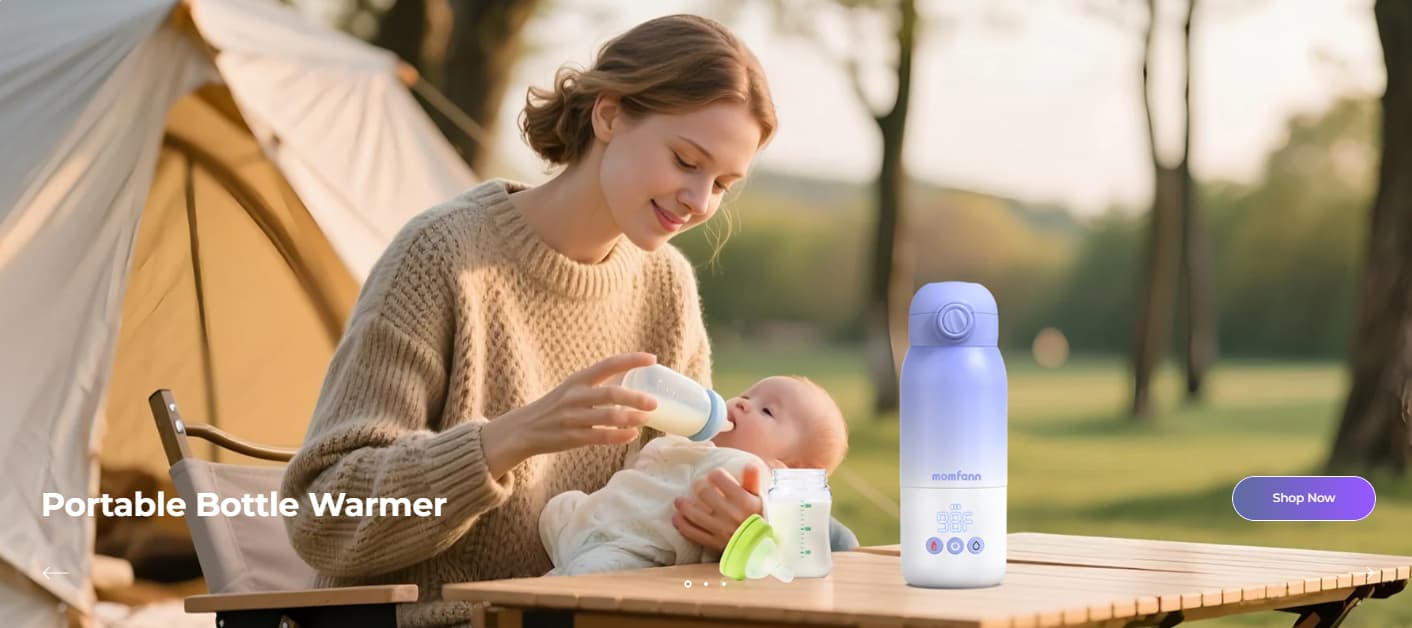 A mother feeds her baby outdoors beside a tent while a Momfann portable bottle warmer sits on a table, highlighting convenient on-the-go feeding for travel and outdoor family outings.