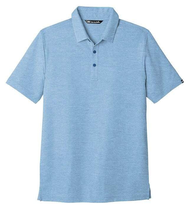 Man wearing a dark patterned TravisMathew polo with casual trousers
