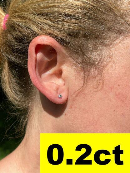Harlembling 0.2ct moissanite solitaire stud worn on the ear
