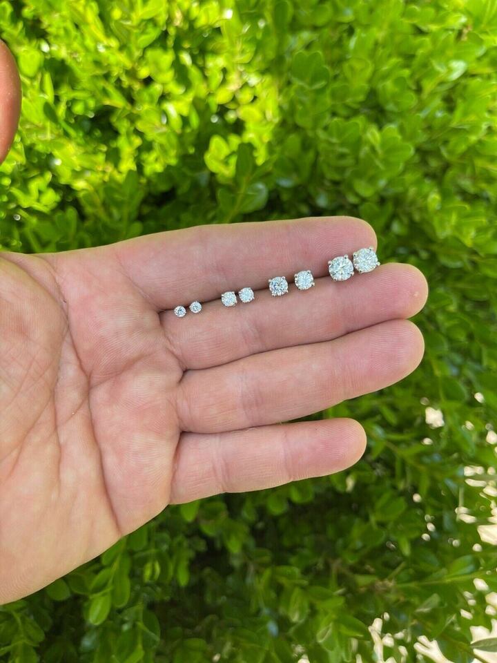 Harlembling moissanite solitaire studs arranged from smaller to larger sizes