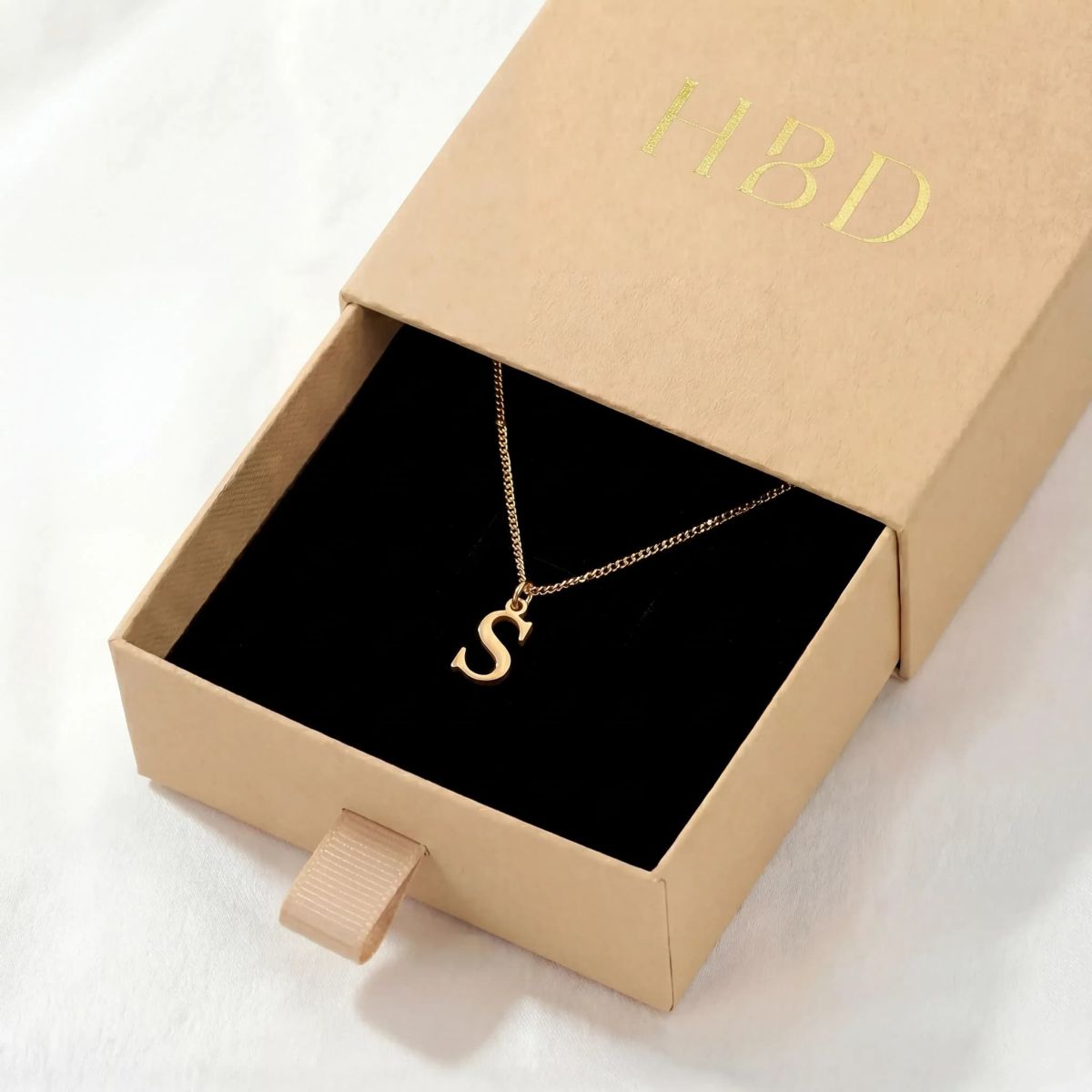 Gold S initial necklace gift box thumbnail