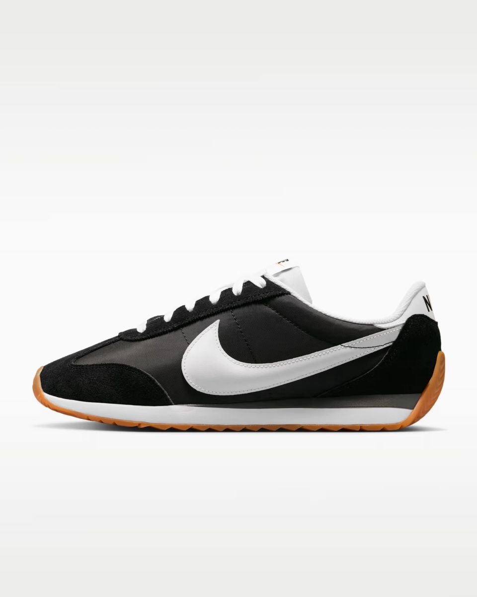 Black running-inspired traditional sneaker with white side detail and gum outsole