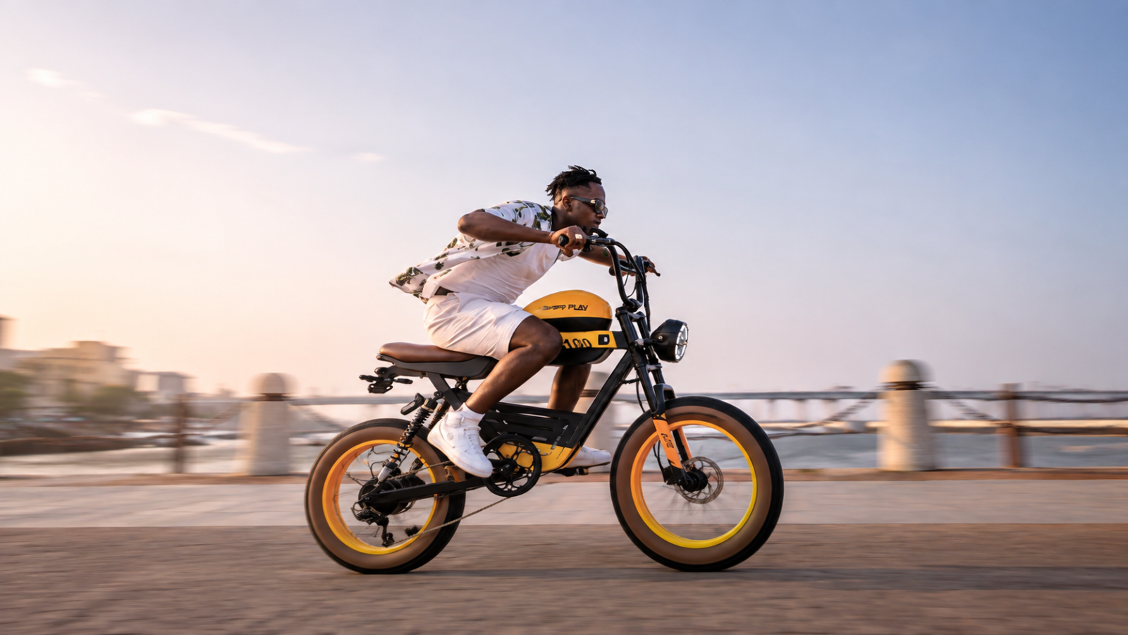 Rider on a yellow-and-black HappyRun electric bike