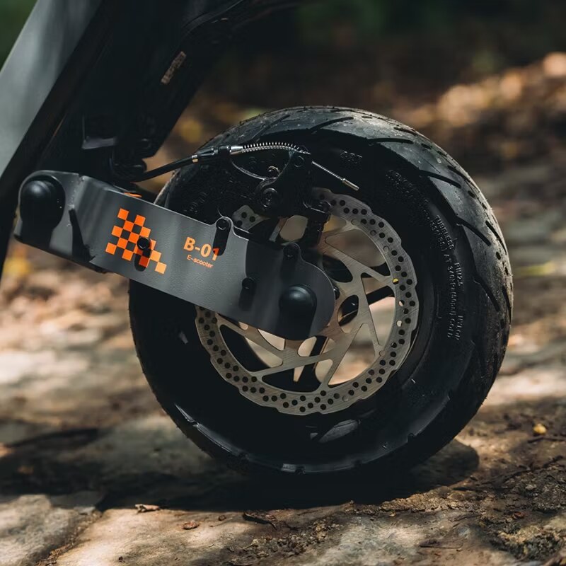 KuKirin G4 electric scooter on rough terrain