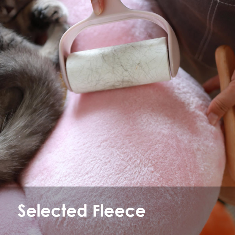 Fleece surface being cleaned on the Three Tier Flower Cat Tree
